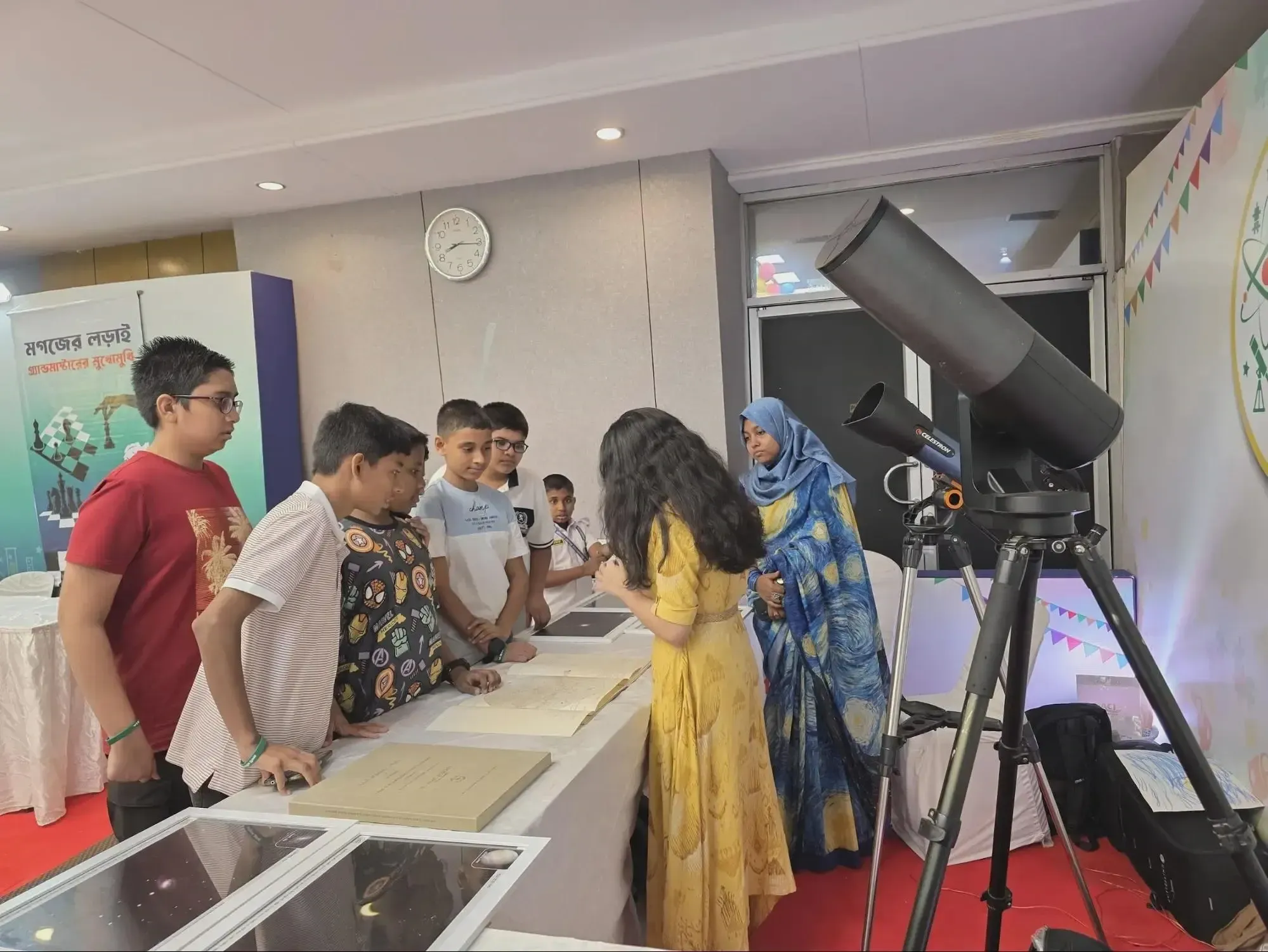 Durbin volunteers explaining the digital telescopes
