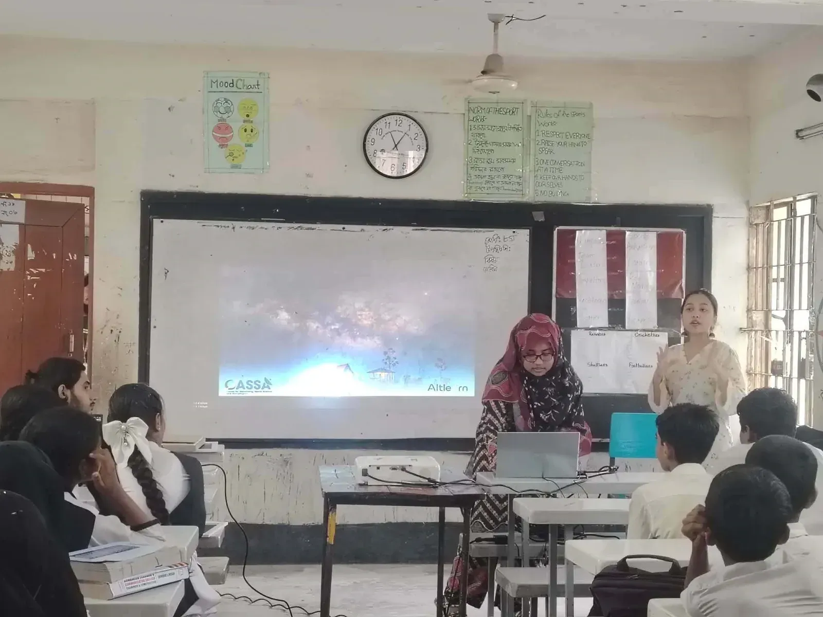 Durbin volunteers introduce CASSA and Durbin to the students with a projected presentation.