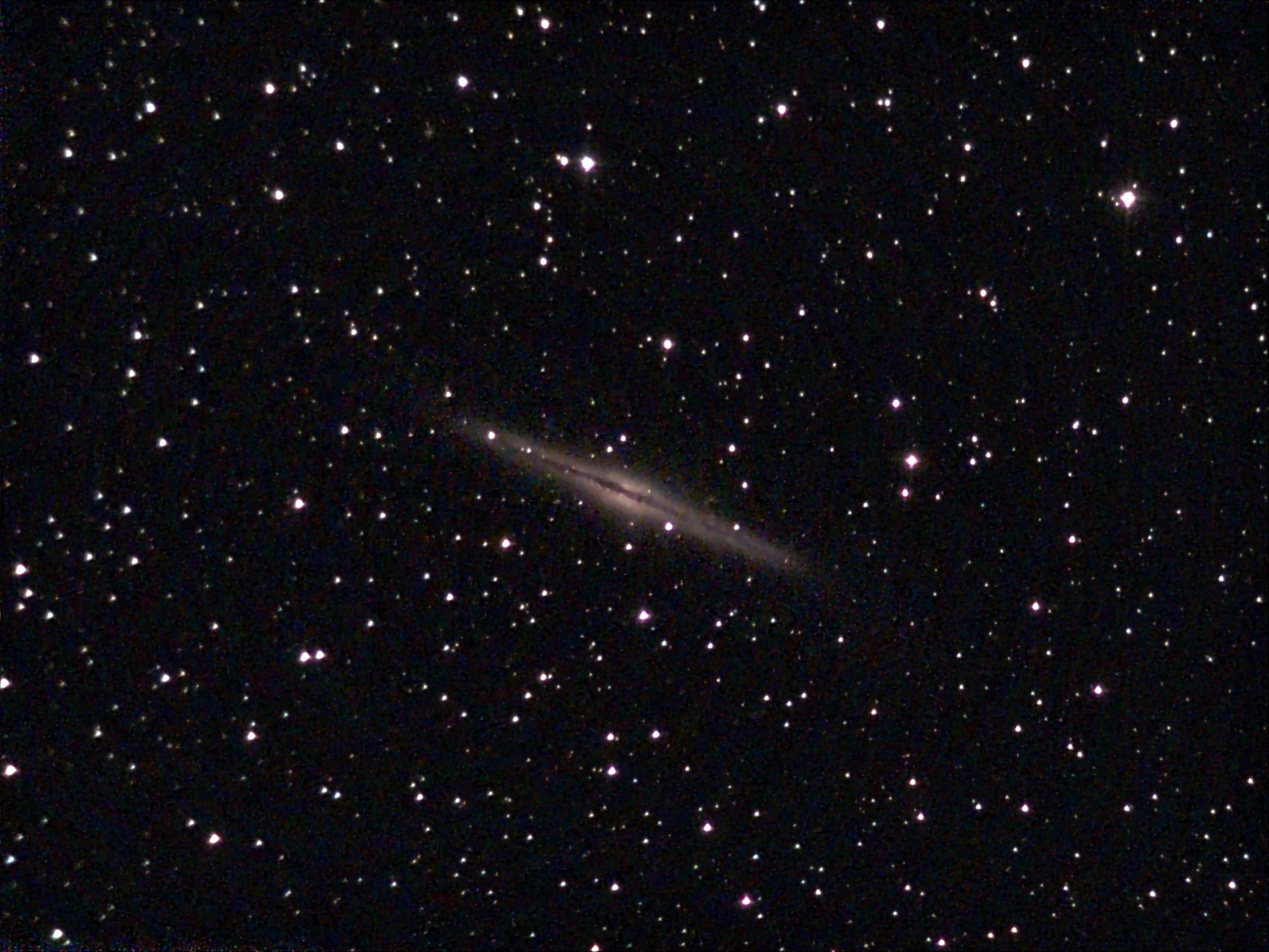 an image ngc891 in the starry sky captured by an astrophotographer with telescope